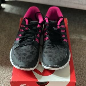 Black/pink cheetah print Nike tennis shoes